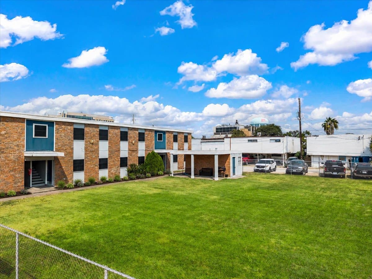 Brick courtyard and lawn at 320 Market Street in Galveston